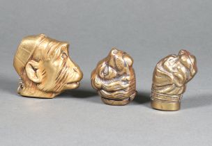 An embossed gilt metal vesta case in the form of a monkey's head 5cm together with 2 others in the