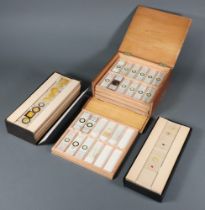 A collection of 93 1940's microscopic slides contained in a shallow oak box together with 100