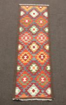 A red, brown and blue ground Maimana Kilim runner 203cm x 65cm