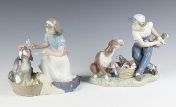 A Lladro group of a boy with dog 5376 17cm, ditto girl feeding a dog 5921 15cm