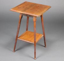 An Edwardian square walnut 2 tier occasional table, raised on ring turned supports 68cm h x 43cm w x