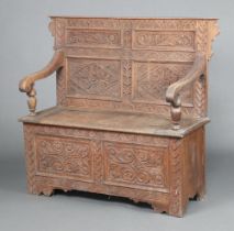 A Victorian carved oak settle with raised back 104cm h x 114cm w x 41cm d (seat 69cm x 30cm) It is