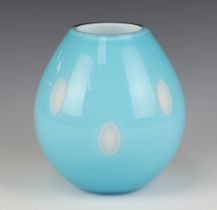 A Studio Glass blue baluster vase decorated with oval white glass panels 18cm