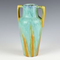 A Studio Pottery slip glazed 2 handled urn/vase 23cm