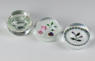 A Caithness paperweight Thistle no.126 of 750 7cm, Whitefriars Pansy 248 of 750 7cm and The Fire Fly