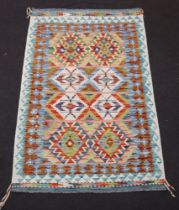 A white, green and sand ground Chobi Kilim rug with diamond designs to the centre 154cm x 98cm