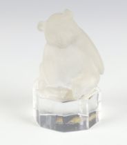 A Goebel frosted glass figure of a bear sitting on an octagonal clear glass base, etched Goebel