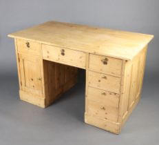 A Victorian pine desk fitted 1 long and 5 short drawers with cupboard to the side 79cm h x 135cm w x