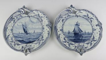 A pair of Royal Bonn Delft shell shaped wall plaques decorated with boats 1193 34cm