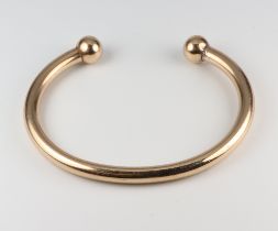 A 9ct yellow gold torque bracelet 25.1 grams, 5.5cm interior measurement