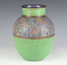 A Royal Doulton baluster vase decorated with flowers on a green ground 23cm
