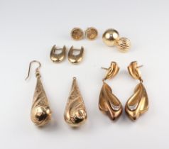 A pair of yellow metal repousse earrings, 3 other pairs and 2 odd studs, 13.3 grams