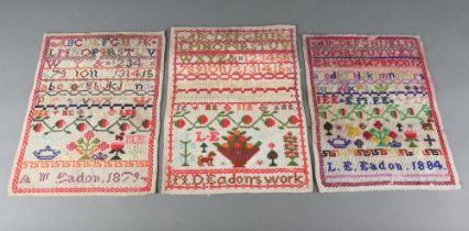 Two Victorian wool work samplers with alphabet and numbers by A M Eadon 1879 and L E Eadon 1874
