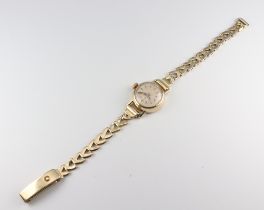 A lady's yellow metal 585 wristwatch, the dial inscribed Junghans, gross weight including movement