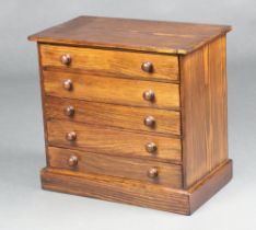 A Victorian rectangular pine collectors chest of 5 drawers with turned handle, raised on a