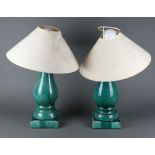 A pair of Chinese turquoise oviform table lamps on square bases 37cm