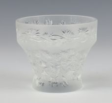 A modern Lalique frosted and moulded glass tea light holder decorated with flowers, engraved lower