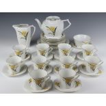 An Art Deco Czechoslovakian tea set decorated with stylised flowers comprising 10 tea cups (3 a/