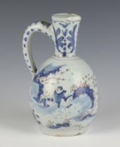 A 19th Century Delft jug decorated with figures in landscapes 19cm The handle and lip are chipped