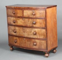 A Victorian mahogany bow front chest of 2 short and 3 long drawers raised on bun feet 106cm h x