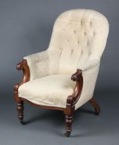 A Victorian mahogany tub back chair upholstered in white buttoned material raised on turned supports