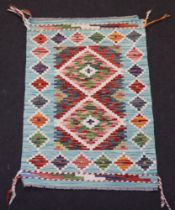 A turquoise, brown and white ground Chobi Kilim rug with diamond design, 85cm x 58cm