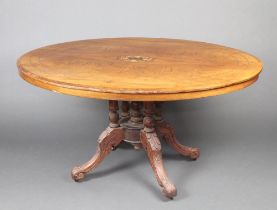 A Victorian quarter veneered inlaid walnut Loo table raised on 4 turned supports raised on