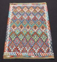 A white, green and yellow ground Chobi Kilim rug 193cm x 125cm