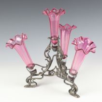 An Art Nouveau epergne with 4 cranberry glass flutes on a scroll tripod base 28cm