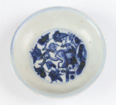 An 18th Century style shallow Chinese dish decorated with flowers 12cm There are minor chips to