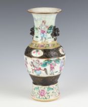 A Chinese crackle glazed oviform vase decorated with a band of figures with lion mask handles 24.5