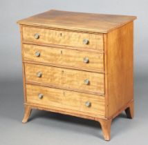 A 19th Century bleached mahogany chest of 4 long graduated drawers with brass handles, raised on