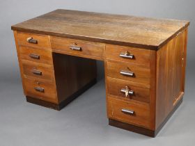 An Art Deco walnut desk fitted 1 long and 8 short drawers, the side fitted a cupboard enclosed by