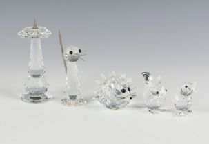A Swarovski Crystal hedgehog 4cm, squirrel 4cm, chick 3cm, sun dial 8cm and cat 7cm (a/f)