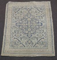 A white and blue ground Afghan rug with central medallion within multi row border 115cm x 92cm