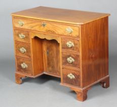 A Georgian mahogany kneehole dressing table fitted a drawer above secret drawer and 6 short drawers,