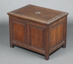 A Eastern carved hardwood rectangular coffer, the hinged lid with Grecian key decoration and