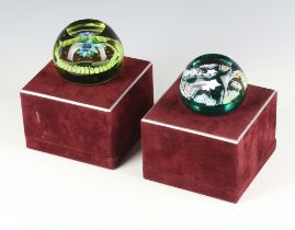 Two Edinburgh Crystal paperweights Emerald Star no.80 of 100 7cm and Aquamarine no.23 of 250 7cm,