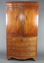 A 19th Century mahogany bow front linen press with moulded and dentil cornice, the interior fitted 2