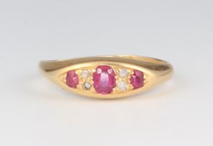 A Victorian 18ct yellow gold ruby and diamond ring comprising 3 oval cut rubies and 3 (ex 4)