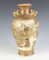 A Meiji Period Japanese Satsuma oviform vase with dragon handles, band of deities and attendants,