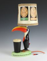 A Carlton Ware Guinness Toucan table lamp - "How grand to be a Toucan, just think what Toucan do, if