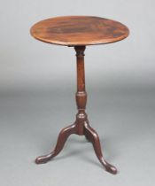 An 19th Century circular mahogany snap top wine table raised on pillar and tripod base 72cm h x 49cm