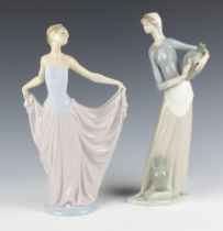 A Lladro figure of a lady 30cm, a ditto of a water carrier 31cm
