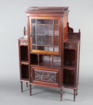 An Edwardian inverted breakfront carved mahogany bookcase, the upper section with pierced gallery,