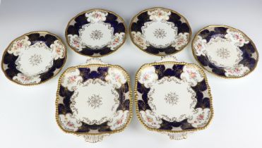 Four Edwardian Coalport dessert plates decorated with spring flowers, together with a pair of