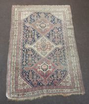 A pink, blue and white ground Persian rug with 3 diamond shaped medallions to the centre 200cm x