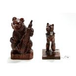 A 20TH CENTURY BLACK-FOREST CARVED WOOD BEAR PENCIL HOLDER, with silver propelling pencil,