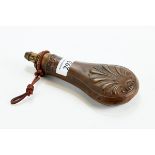 A 19TH CENTURY COPPER & BRASS POWDER FLASK with embossed stylized shell design,