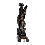 AN ART NOUVEAU PATINATED BRONZE OF VENUS BATHING, unsigned, on a black marble base, 30.5cms high.